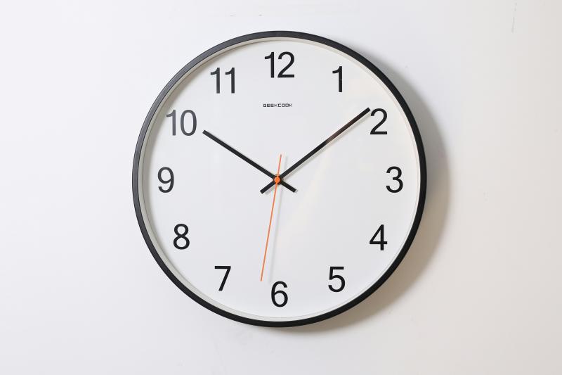 a_clock_on_a_white_wall