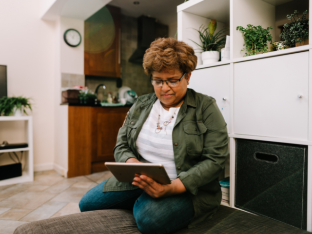 Older woman using an ipad to access dementia training