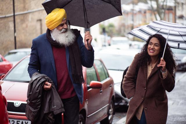 Man and woman walking down street