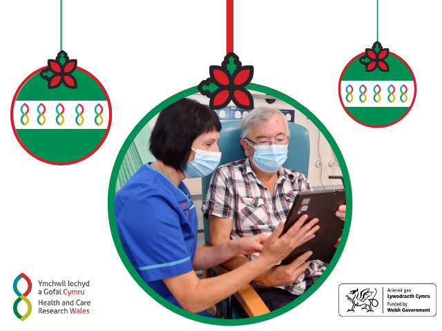 Research nurse helping older male participant complete a questionnaire on an ipad