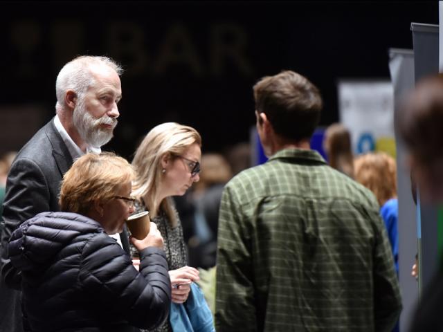 Delegates talk at an exhibition