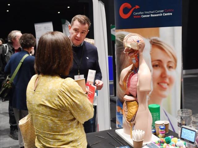 Delegates talk at an exhibition