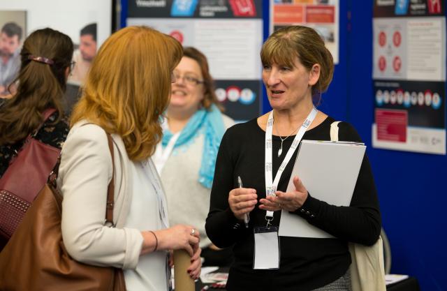 Two women discussing health and care research