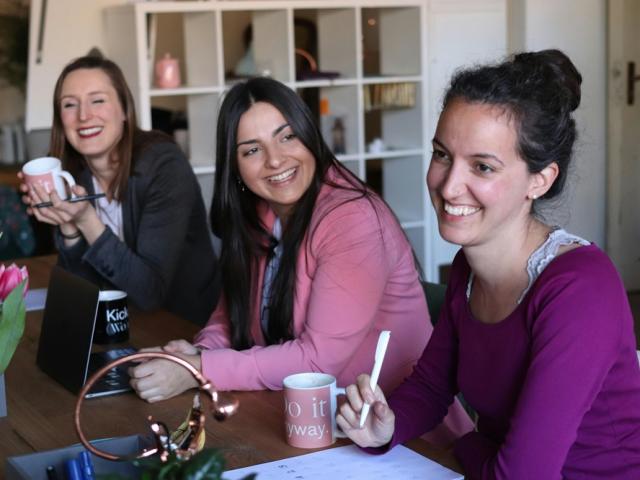 Women at a table talking