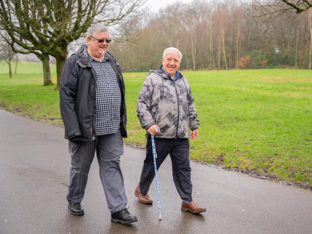 Two men walking.