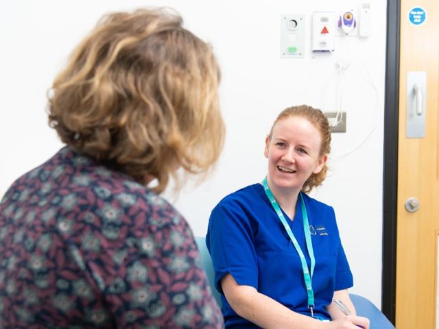 Two women discussing health and care research