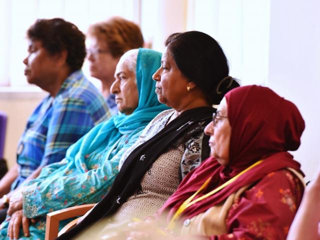 five women attending a talk
