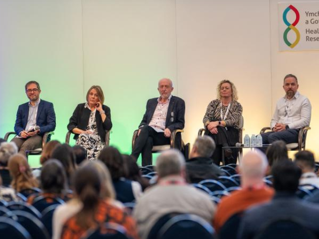 Senior Research Leaders sat on the stage