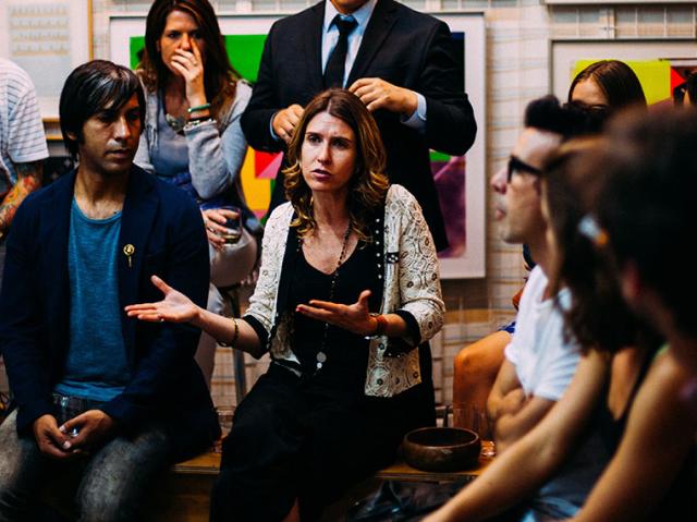 woman talking in a group of people