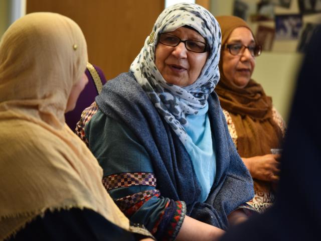 women talking at meeting