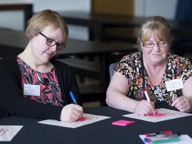 two women at meeting