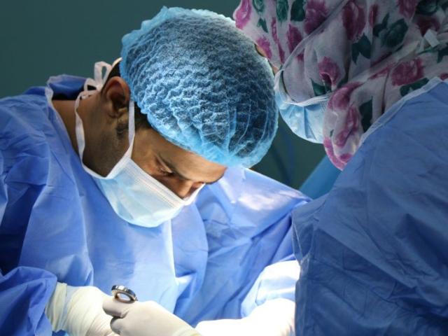 two_clinicians_performing_surgery