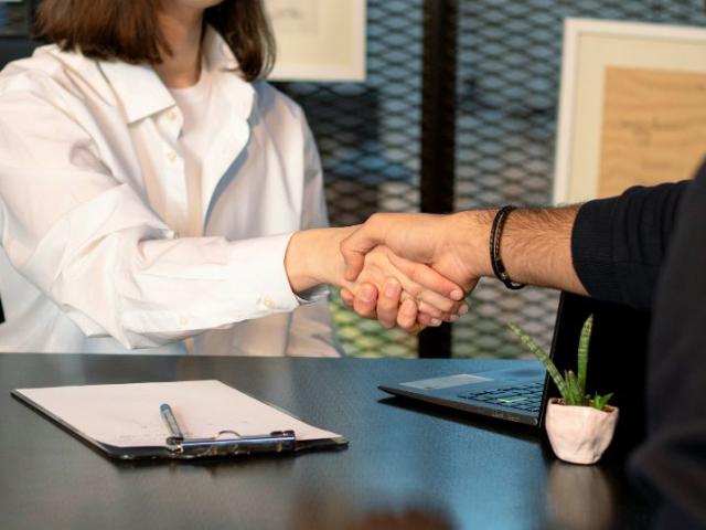 two_people_shake_hands