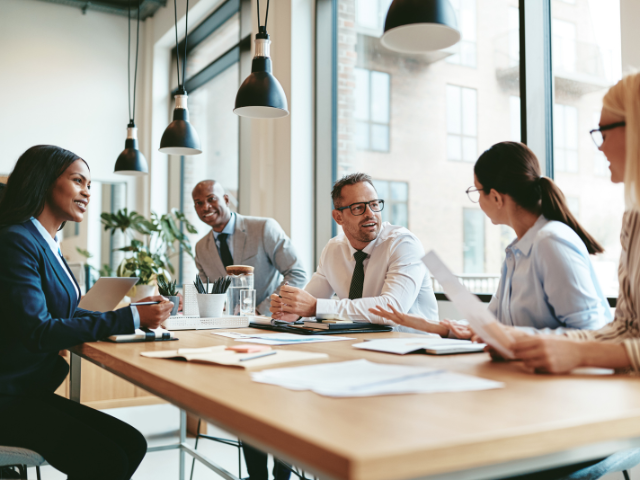 a group of people in a meeting