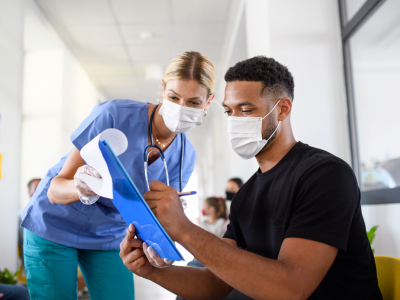 Nurse showing research participant clipboard