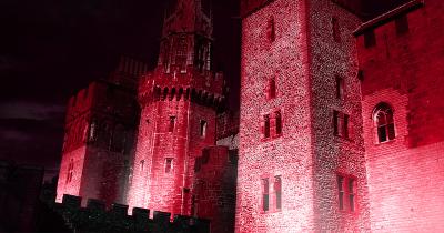 Cardiff Castle lit up in red