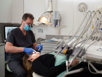 Dentist examining patient