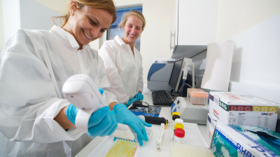 Two health professionals working in a laboratory
