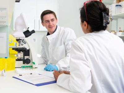 Two researchers working in a lab