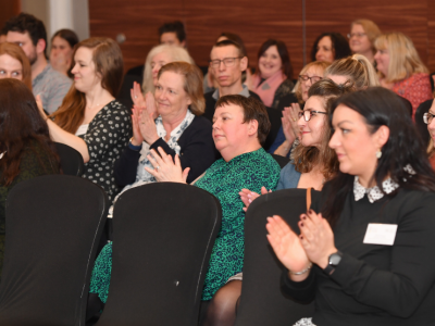 Conference audience clapping