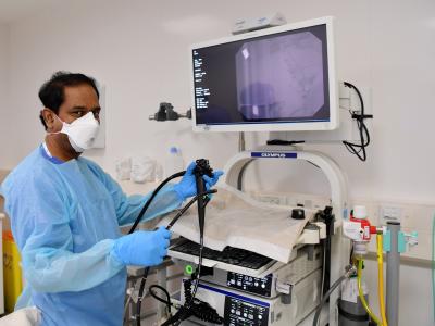 Dr working on medical equipment