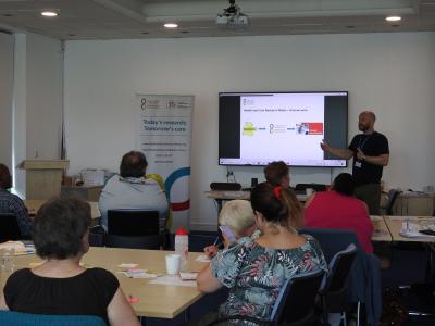 Pete Gee presenting to a group of the public